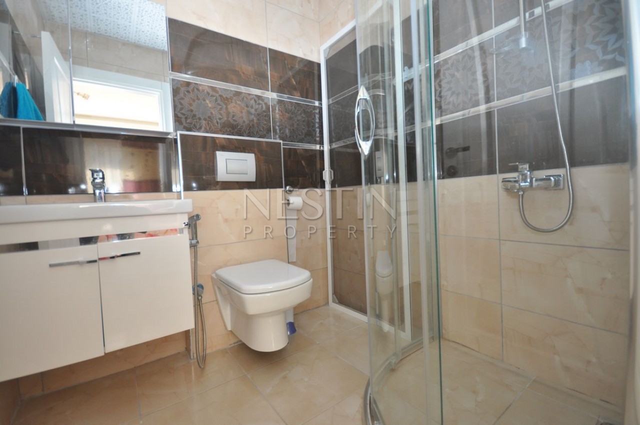 Кваритра 2+1 в современном комплексе в Махмутларе фото 17