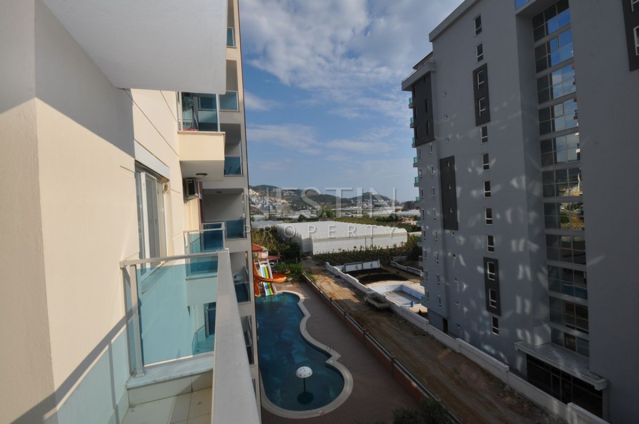 Кваритра 2+1 в современном комплексе в Махмутларе фото 26