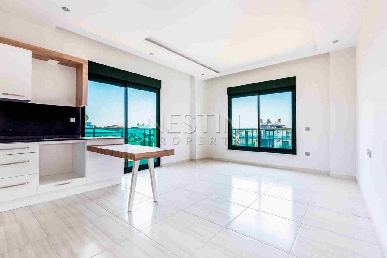 Стильная квартира планировкой 1+1 в районе Авсаллар фото 21