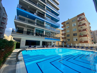 Квартира 1+1 в центре района Махмутлар с видом на море и горы фото 2