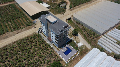 Квартиры планировкой 1+1 и 2+1 в новом жилом комплексе в районе Каргыджак фото 3