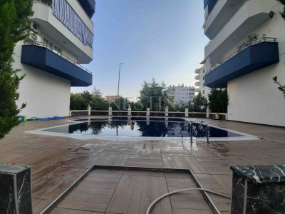 Квартира 1+1 в районе Махмутлар с видом на море фото 3