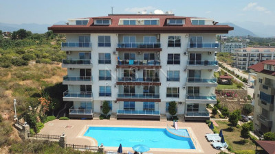 Садовый дуплекс 2+1 в районе Кестель с видом на море фото 1