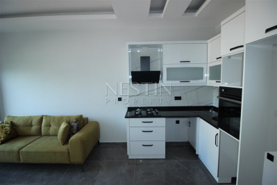 Квартира 1+1 в доме городского типа в районе Оба с видом на горы фото 9