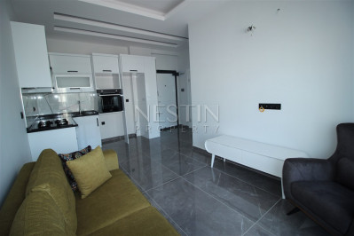 Квартира 1+1 в доме городского типа в районе Оба с видом на горы фото 13