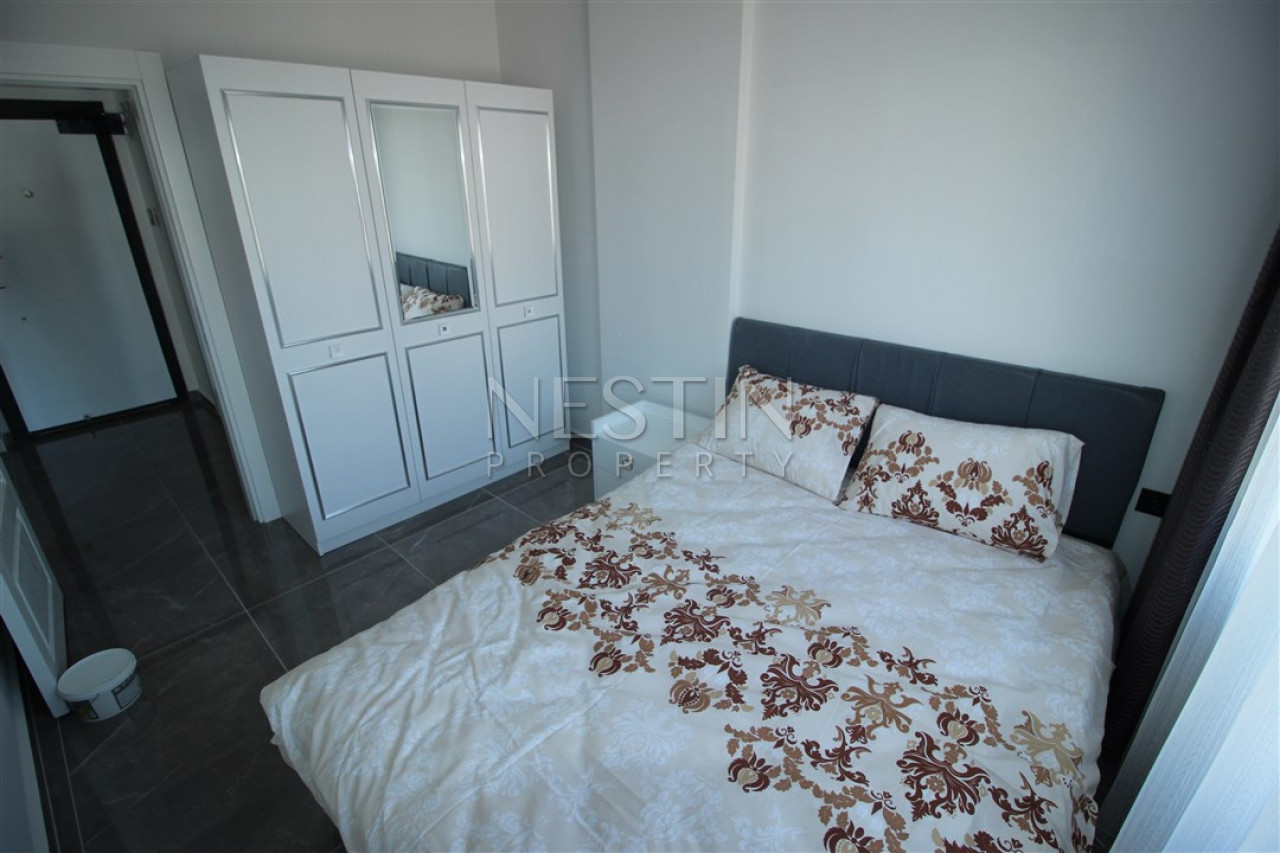 Квартира 1+1 в доме городского типа в районе Оба с видом на горы фото 21