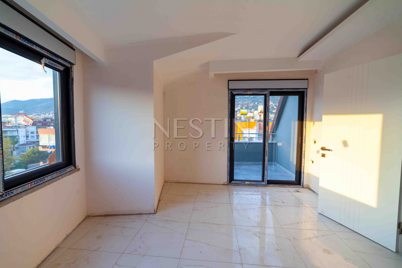 Пентхаус 2+1 в центре Аланьи с видом на горы и историческую крепость фото 12