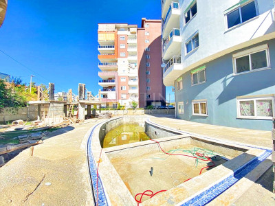 Бюджетное предложение квартиры 1+1 с видом на горы в районе Махмутлар фото 6