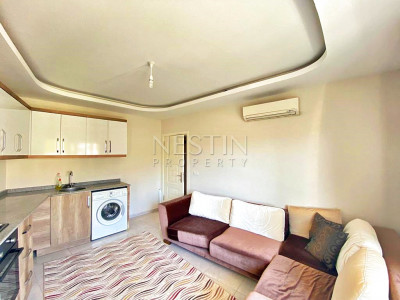 Бюджетное предложение квартиры 1+1 с видом на горы в районе Махмутлар фото 17