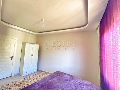 Бюджетное предложение квартиры 1+1 с видом на горы в районе Махмутлар фото 26