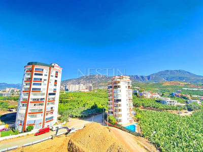 Бюджетное предложение квартиры 1+1 с видом на горы в районе Махмутлар фото 30