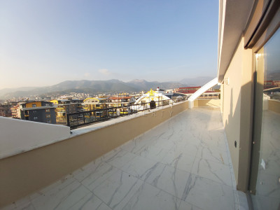 Квартира пентхаус 4+1 в районе Оба с видом на горы фото 1