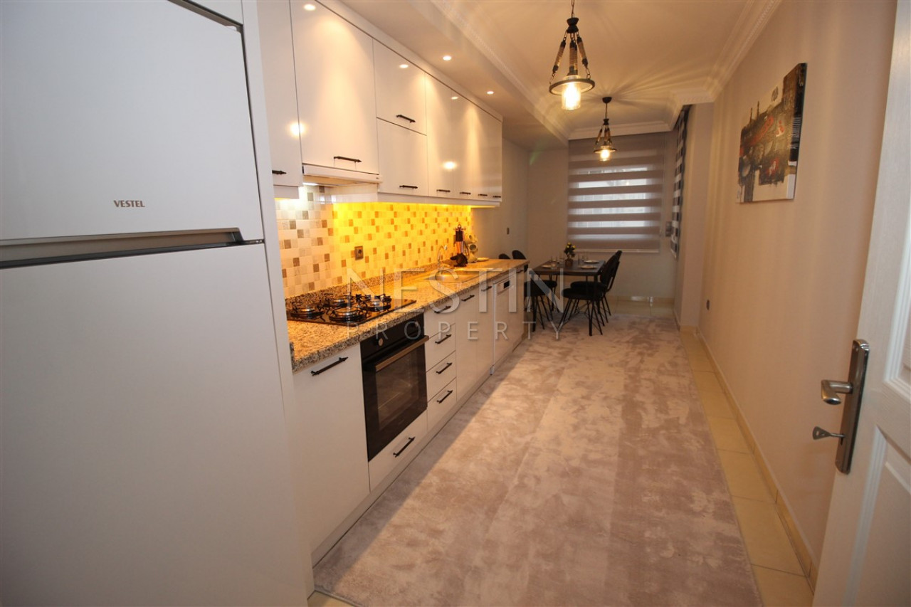 Квартира 3+1 в районе Махмутлар с отдельной кухней фото 14