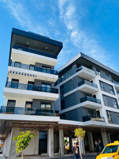 Квартиры 1+1 в новом доме в центре города Аланья в 500 м от моря фото 1