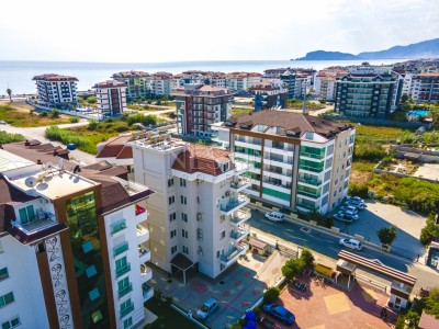 Квартира 1+1 в комплексе района Кестель с видом на море и горы фото 2