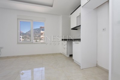 Квартира 1+1 в комплексе района Кестель с видом на море и горы фото 12