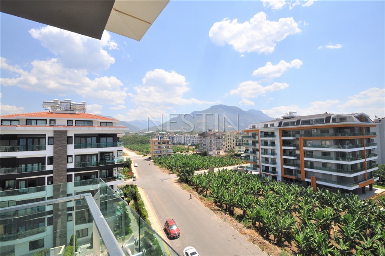 Просторный пентхаус 5+1 в районе Кестель с видом на море и горы фото 25