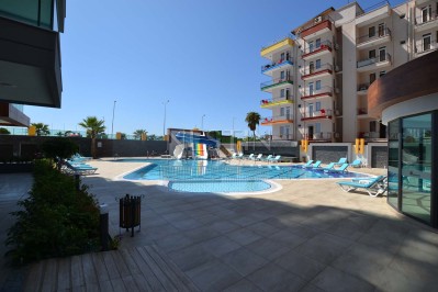 Квартира 1+1 в новом ЖК района Махмутлар с видом на море и горы фото 2