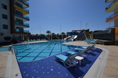 Квартира 1+1 в новом ЖК района Махмутлар с видом на море и горы фото 3