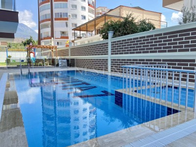 Апартаменты 1+1 с видом на горы в районе Махмутлар фото 2