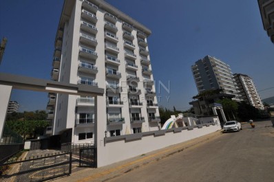 Квартира 1+1 в современном комплексе в районе Махмутлар фото 1