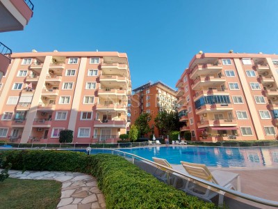 Уютная квартира 2+1 в районе Махмутлар с частичным видом на море фото 1