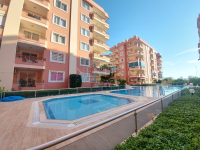 Уютная квартира 2+1 в районе Махмутлар с частичным видом на море фото 2