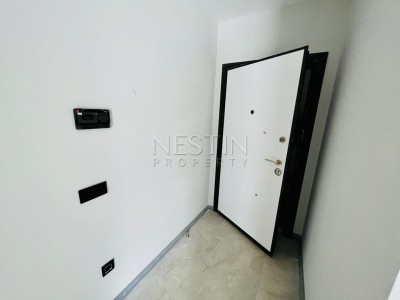 Квартира 1+1 в большой террасой в новом ЖК в центре города Аланья фото 15