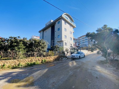 Апартаменты 1+1 в новом жилом доме в районе Оба фото 2