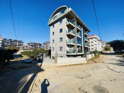 Апартаменты 1+1 в новом жилом доме в районе Оба фото 3