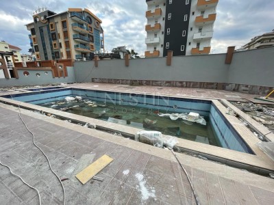 Квартира пентхаус 1+1 в новом доме района Кестель в 100 м от моря фото 3