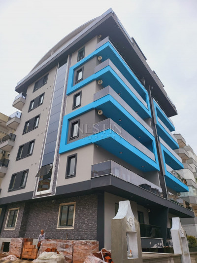 Квартира 1+1 в новом доме района Махмутлар в 400 м от моря фото 1