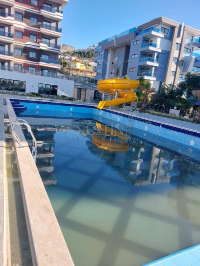 Новая квартира 1+1 в районе Каргыджак, в доме с хорошей инфраструктурой фото 1