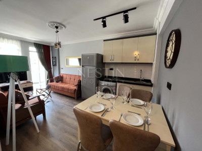 Квартира 1+1 в районе Оба со стильным интерьерным дизайном фото 1