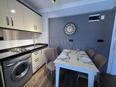 Квартира 1+1 в районе Оба со стильным интерьерным дизайном фото 2