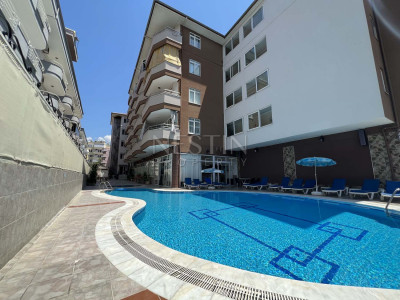 Квартира 1+1 в районе Оба со стильным интерьерным дизайном фото 9