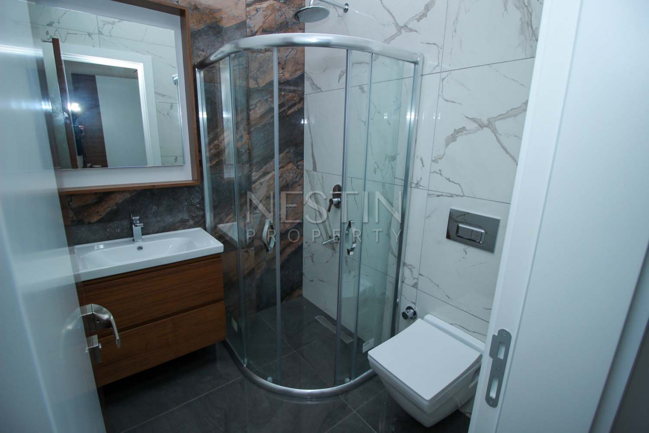 Просторный дуплекс с видом на море 4+1 в районе Тосмур фото 27