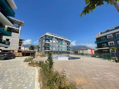 Светлая квартира 2+1 в новом комплексе района Оба, в 1300 м от Средиземного моря фото 1